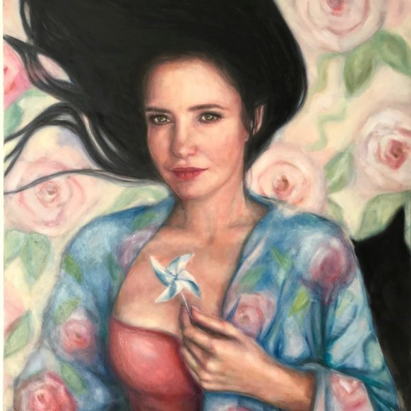 portrait with a wind wheel and a cat